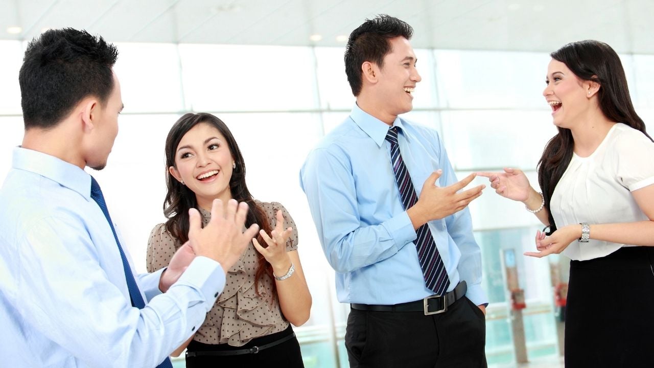 asian employees talking 